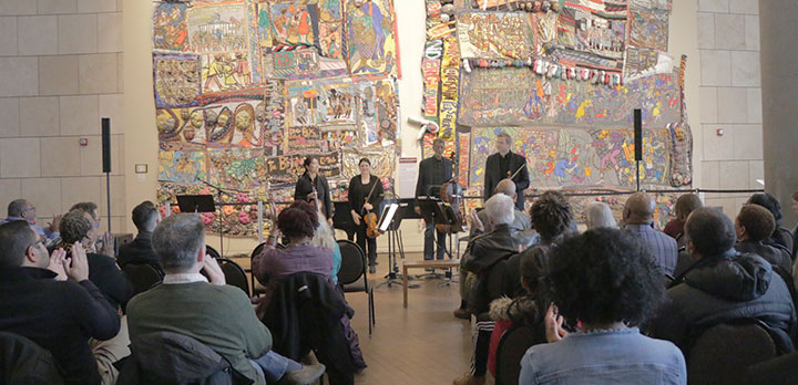 A chamber quartet performs at a local museum