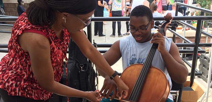 A Music Lab shows a guest how to play a cello